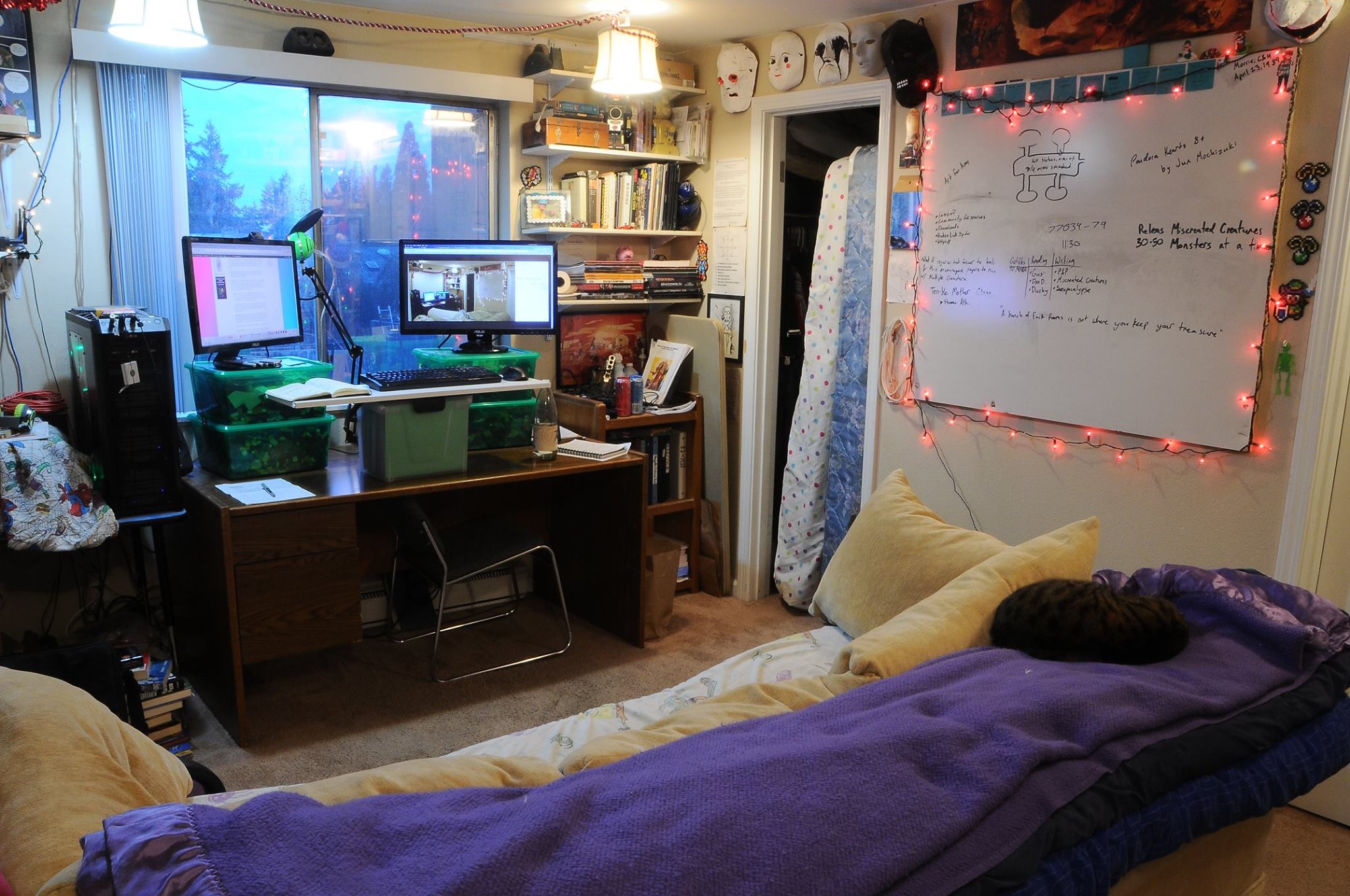 My office in 2018. You can see last year's office photo on my computer monitors, which are resting on stacked lego buckets so they can work as a standing desk.