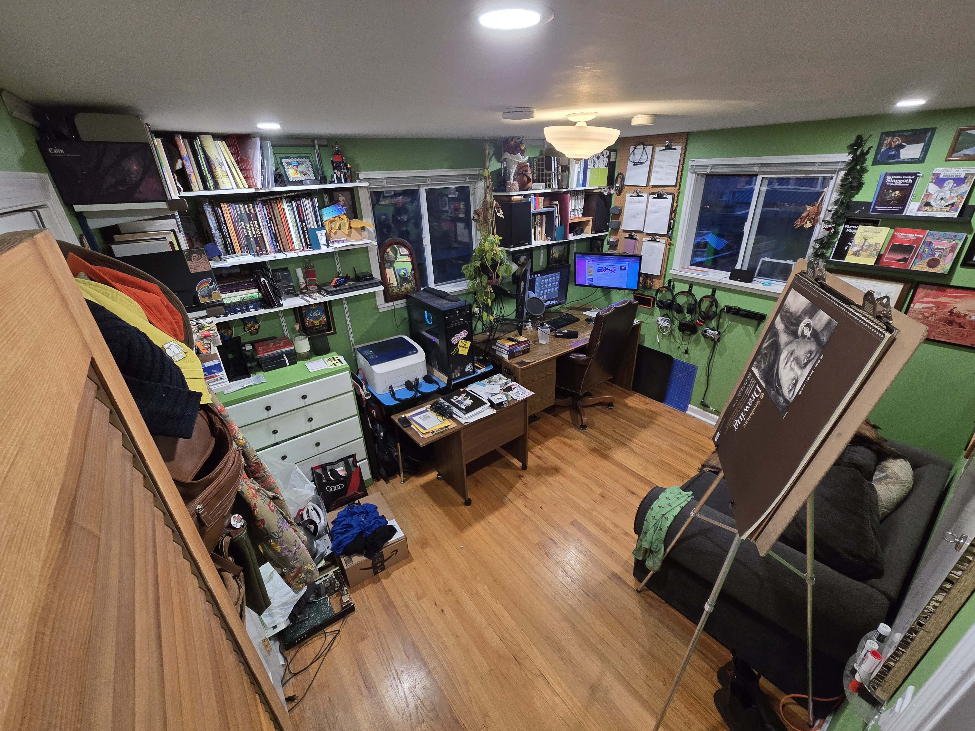 My office in 2025. No decorations in here, we've toned decorating down quite a bit as this year has been pretty exhausting and none of us have that energy right now. My space is a bit of a mess, but I've got a new door since last year, and I've replaced the bed with the couch that was in here originally, which I always missed.