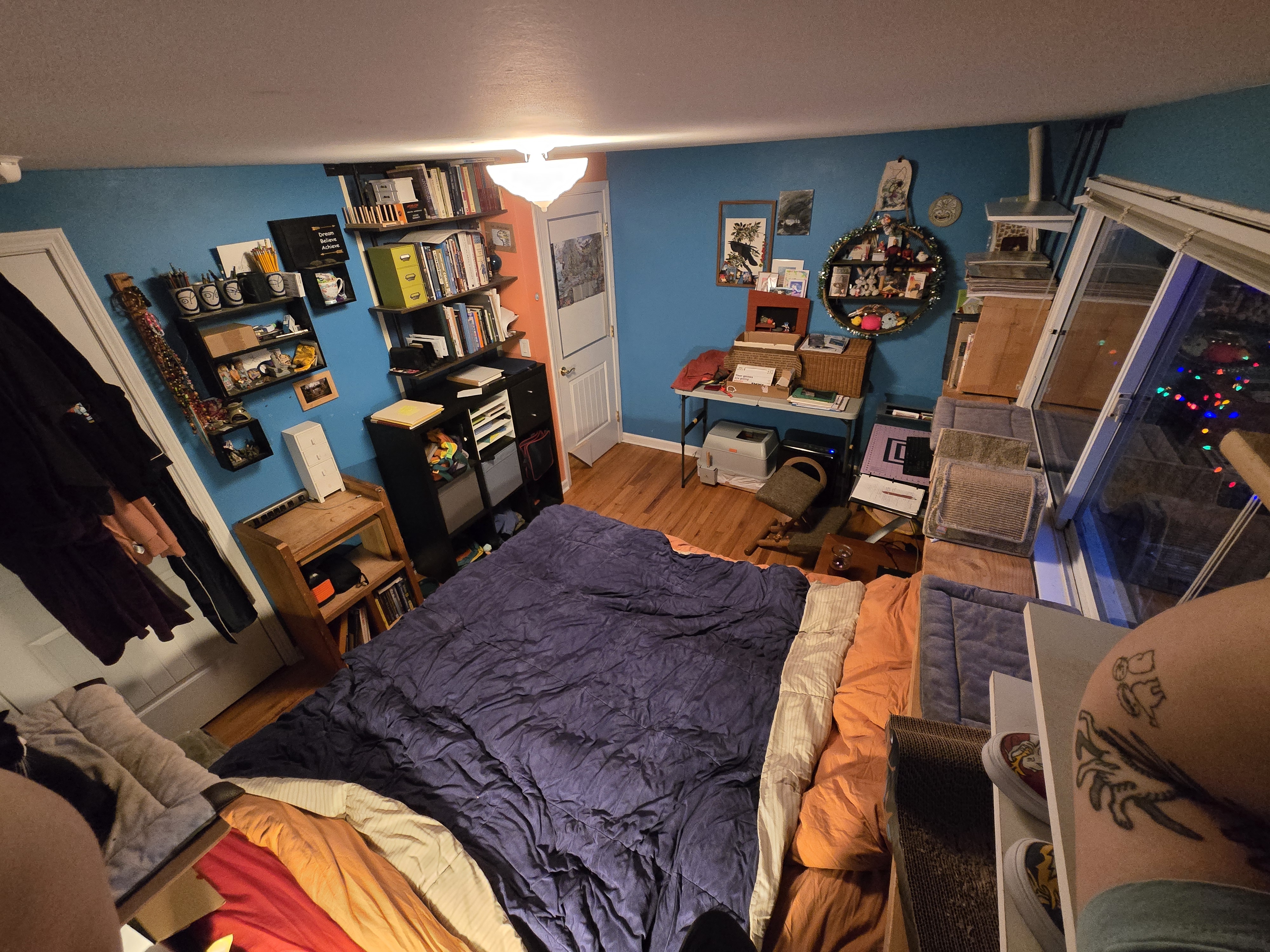 Morrie's office in 2025. Never the same layout two years in a row with this guy! Also my elbow is visible again, with a new tattoo since last year.